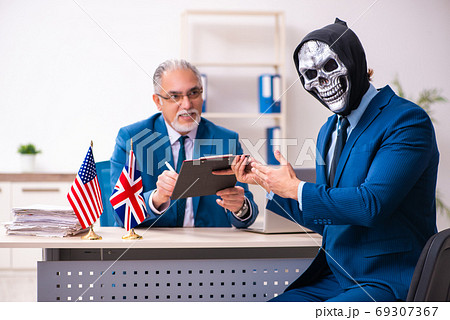 Old businessman employee getting deal with the devil 69307367