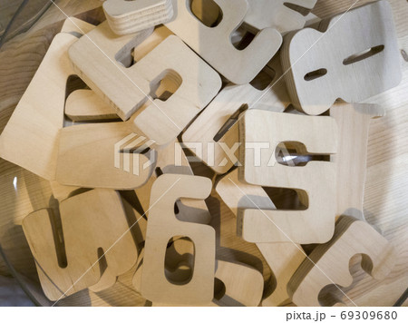 wooden figures, figures from plywood lie on the table wooden figures, figures from plywood lie on the table 69309680