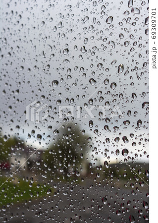 drops of water on the glass on a rainy day, glass with drops of water 69309701