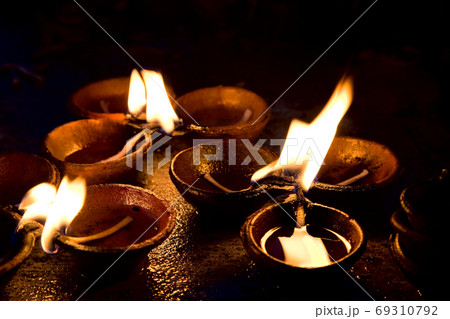 Burning candles on altar in buddhist temple, Sri Lanka Burning candles on altar in buddhist temple, Sri Lanka 69310792
