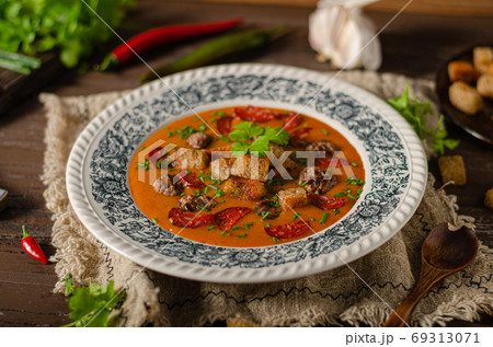 Goulash soup with beef and spicy sausage Goulash soup with beef and spicy sausage 69313071