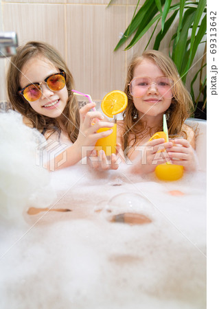 children relax in tub. cannot leave country. children relax in tub. cannot leave country. 69313642