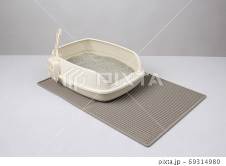 white plastic litter cat with sand on gray litter mat white plastic litter cat with sand on gray litter mat 69314980