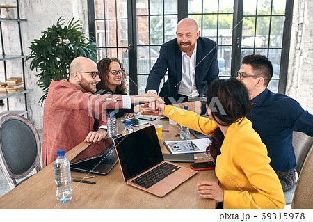 Group of joyful smiling happy people celebrate win with arms up. Mediation offer high five friendship deal achievement strike bargain good news friendly consent successful effective strategy Group of joyful smiling happy people celebrate win with arms up. Mediation offer high five friendship deal achievement strike bargain good news friendly consent successful effective strategy 69315978