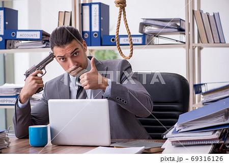 Young male employee committing suicide at workplace Young male employee committing suicide at workplace 69316126