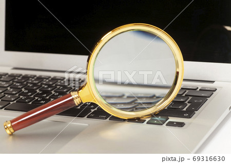 Laptop With Magnifying Glass Laptop With Magnifying Glass 69316630