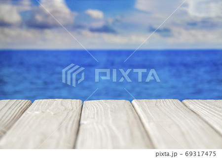 White empty wooden walkway at seacoast with cloudy 69317475