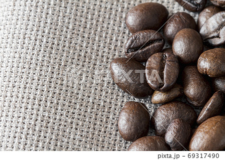 Close-up of coffee beans on linen fabric with copy Close-up of coffee beans on linen fabric with copy 69317490