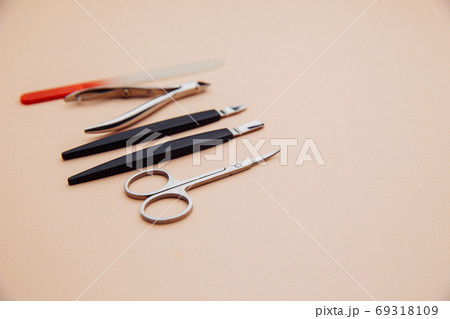 Tools of a manicure set on a pink background 69318109