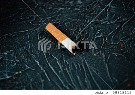 Smoldering cigarette. Dangerous habit 69318112