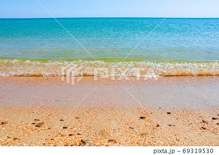 Soft Wave Of Blue Ocean On Sandy Beach. Background. Selective focus 69319530