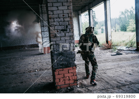 Soldier in combat. Urban combat training, soldier entering abandoned building. Anti terrorist operation battlefield training. 69319800
