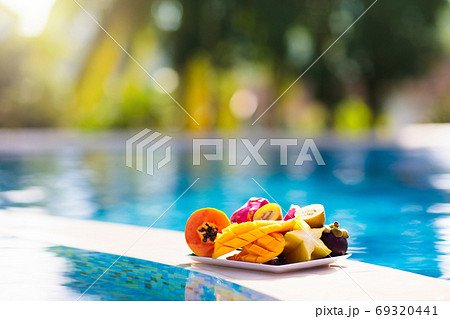 Tropical fruit at swimming pool 69320441