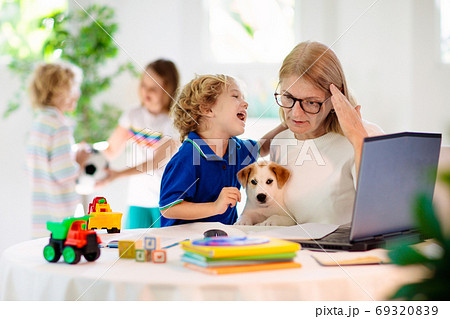 Mother working from home with kids. Quarantine. Mother working from home with kids. Quarantine. 69320839