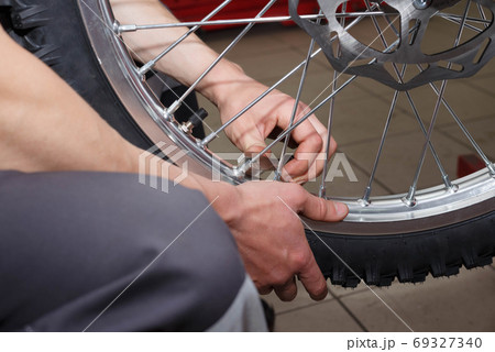 Motorcycle wheel repair after tire leaks or disc damage. Motorcycle wheel repair after tire leaks or disc damage. 69327340