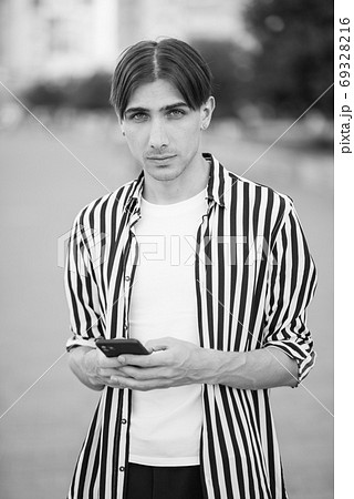 Portrait of a gay man - member of the LGBTQ community. Black and white photo. BW 69328216