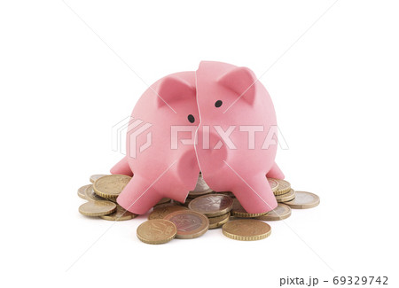 Broken piggy bank with coins on white background with clipping path Broken piggy bank with coins on white background with clipping path 69329742
