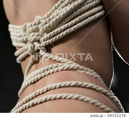 Woman body tied up with rope isolated view - Stock Photo [69332258