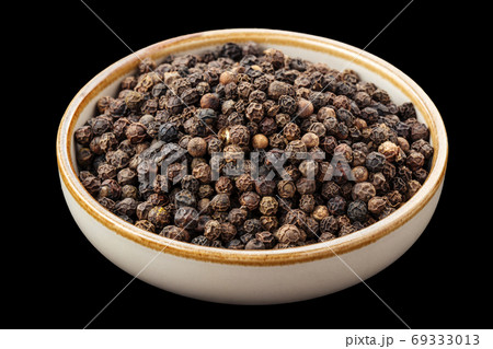 PSD black peppercorns in a bowl isolated on black  69333013