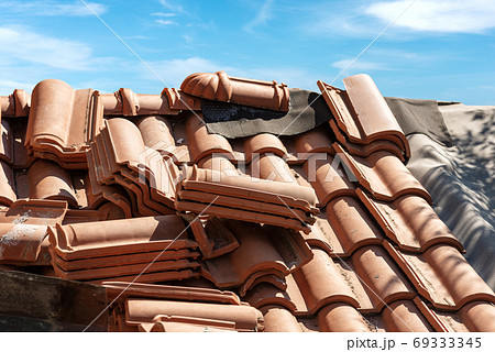 Closeup of a Roof under Repair with Orange Tiles - Italy Closeup of a Roof under Repair with Orange Tiles - Italy 69333345