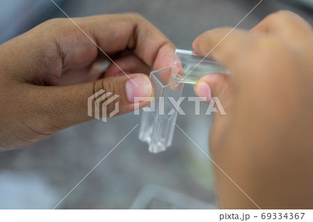 Sample analysis using Spectrophotometer for lab experiments. 69334367