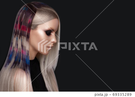 Beautiful girl with multi-colored hair and creative make up and hairstyle. Beauty face. 69335289