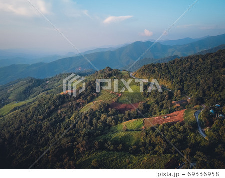 Mountains and green trees during the day 69336958