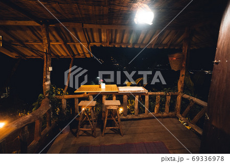 Asia homestay in orange lights at night 69336978