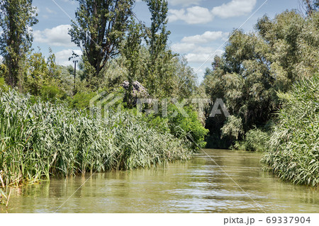 Danube biosphere reserve Belgorodske river summer landscape in Vilkove, Ukraine. Danube biosphere reserve Belgorodske river summer landscape in Vilkove, Ukraine. 69337904