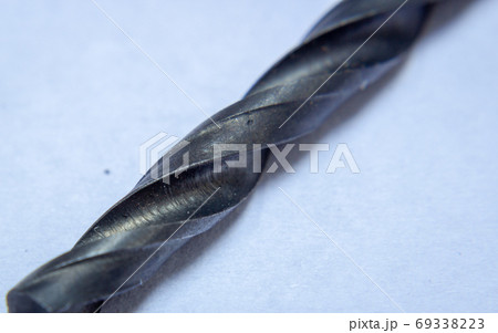 Close up on the cutting edge of a carbon drill, used in wood and soft materials Close up on the cutting edge of a carbon drill, used in wood and soft materials 69338223
