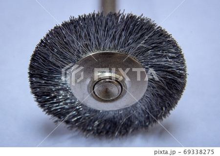 Steel brush used with rotary tools to clean metal surfaces Steel brush used with rotary tools to clean metal surfaces 69338275