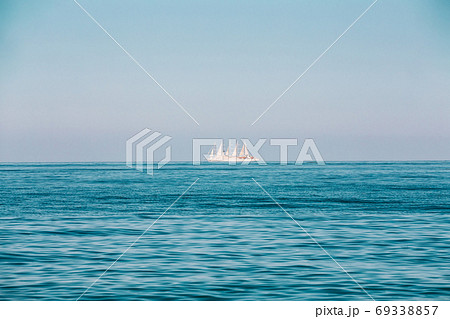 Modern Sail Ship at Sea Ocean On Horizon Modern Sail Ship at Sea Ocean On Horizon 69338857