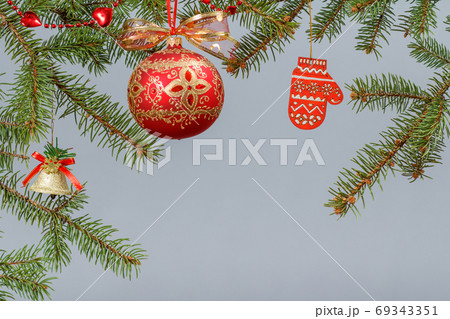 Branches of fir tree with Christmas ornament Branches of fir tree with Christmas ornament 69343351