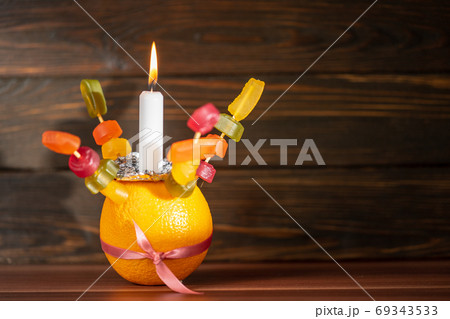 Orange Christingle is a symbolic object used in the Advent, Christmas and Epiphany services of many Christian denominations Orange Christingle is a symbolic object used in the Advent, Christmas and Epiphany services of many Christian denominations 69343533