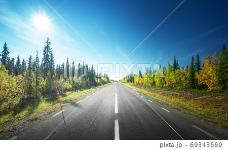 Road in autumn forest, Sweden Road in autumn forest, Sweden 69343660