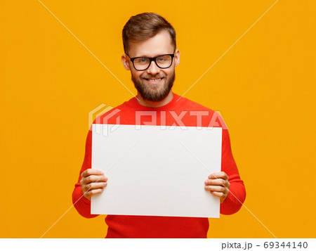 Friendly man with blank placard. Friendly man with blank placard. 69344140