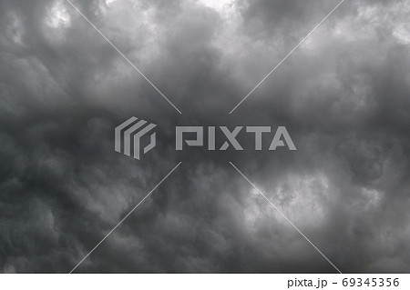 Dark dramatic cloudy overcast sky with thunderstorm clouds Dark dramatic cloudy overcast sky with thunderstorm clouds 69345356