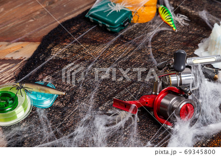 Fishing tacles on wooden background in Halloween designe with sp 69345800