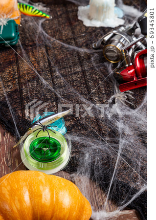 Fishing tacles on wooden background in Halloween designe with sp Fishing tacles on wooden background in Halloween designe with sp 69345801