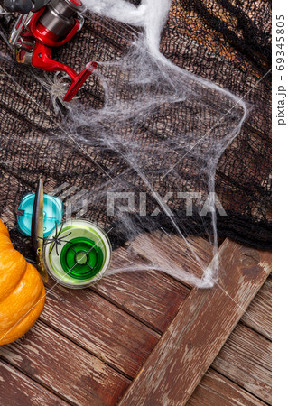 Fishing tacles on wooden background in Halloween designe with sp Fishing tacles on wooden background in Halloween designe with sp 69345805