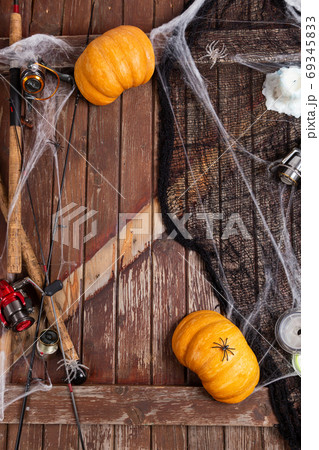Fishing tacles on wooden background in Halloween designe with sp Fishing tacles on wooden background in Halloween designe with sp 69345833