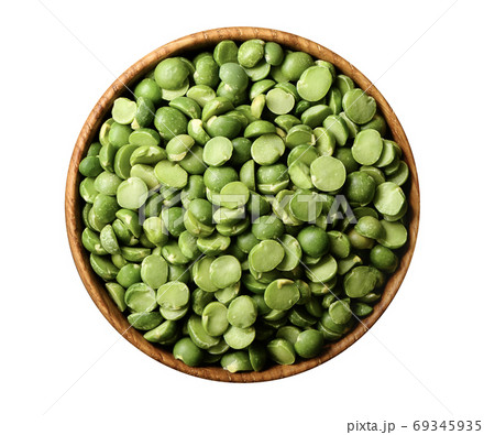 Dried green splin peas in wooden bowl isolated on white 69345935