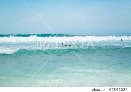 Surfer. Surfing Man With Surfboard Walking On Sandy tropical Beach. water activities Surfer. Surfing Man With Surfboard Walking On Sandy tropical Beach. water activities 69346022