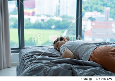 The girl accidentally fell asleep in bed at noon The girl accidentally fell asleep in bed at noon 69346329