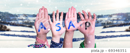 Children Hands Building Word ASAP, Snowy Winter Background 69346351