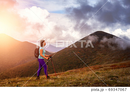 Adventurous Girl Hiking on the Mountain Adventurous Girl Hiking on the Mountain 69347067
