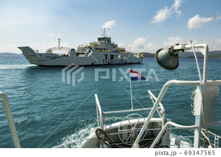 Ferry sailing between Orebic and Korcula island. Ferry sailing between Orebic and Korcula island. 69347565