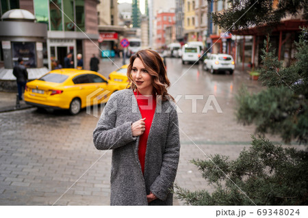 girl stands near road against the background taxi girl stands near road against the background taxi 69348024
