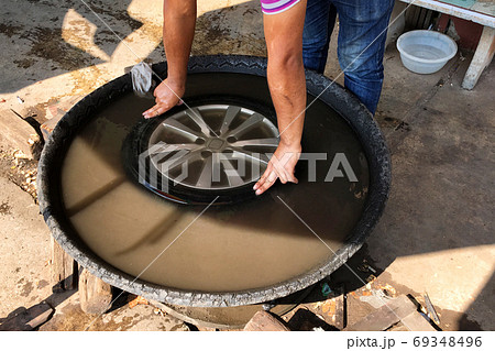 Finding a inner tube puncture in the water. Finding a inner tube puncture in the water. 69348496