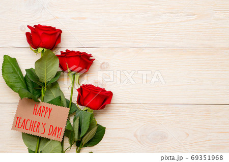 happy teacher's day, red roses with greetings on craft paper car happy teacher's day, red roses with greetings on craft paper car 69351968